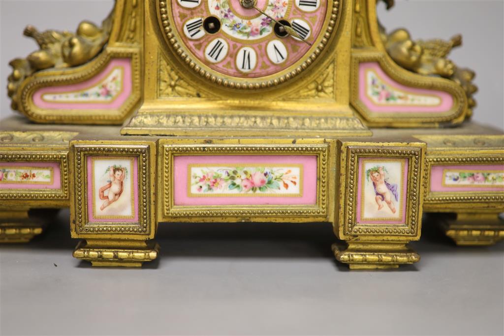 A 19th century French gilt metal and porcelain inset mantel clock, height 37cm